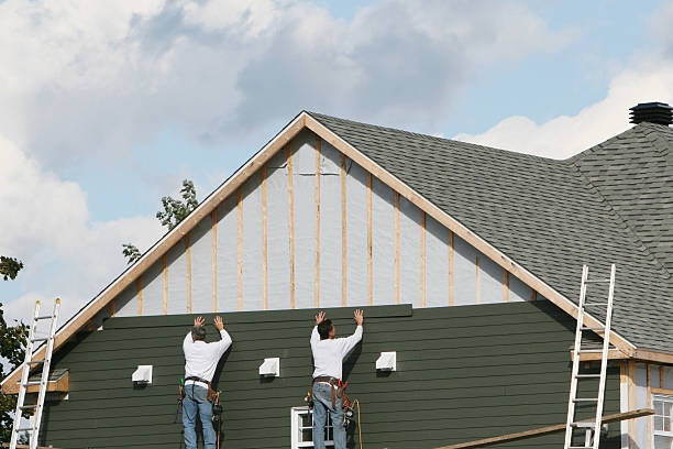 Professional Storm Damage Siding Repair technician working in Houston, PA